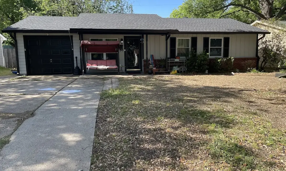 Hail Damage Roof Repair crew at work on a residential roof in Dumas